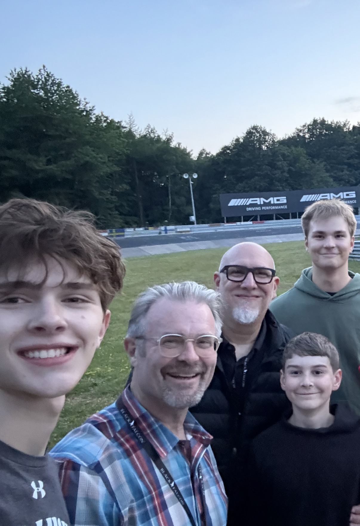 Ethan with family at a motorsport track