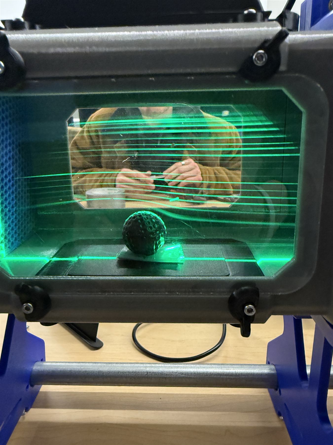 Laser sheet flow visualization over a dimpled sphere in the wind tunnel lab